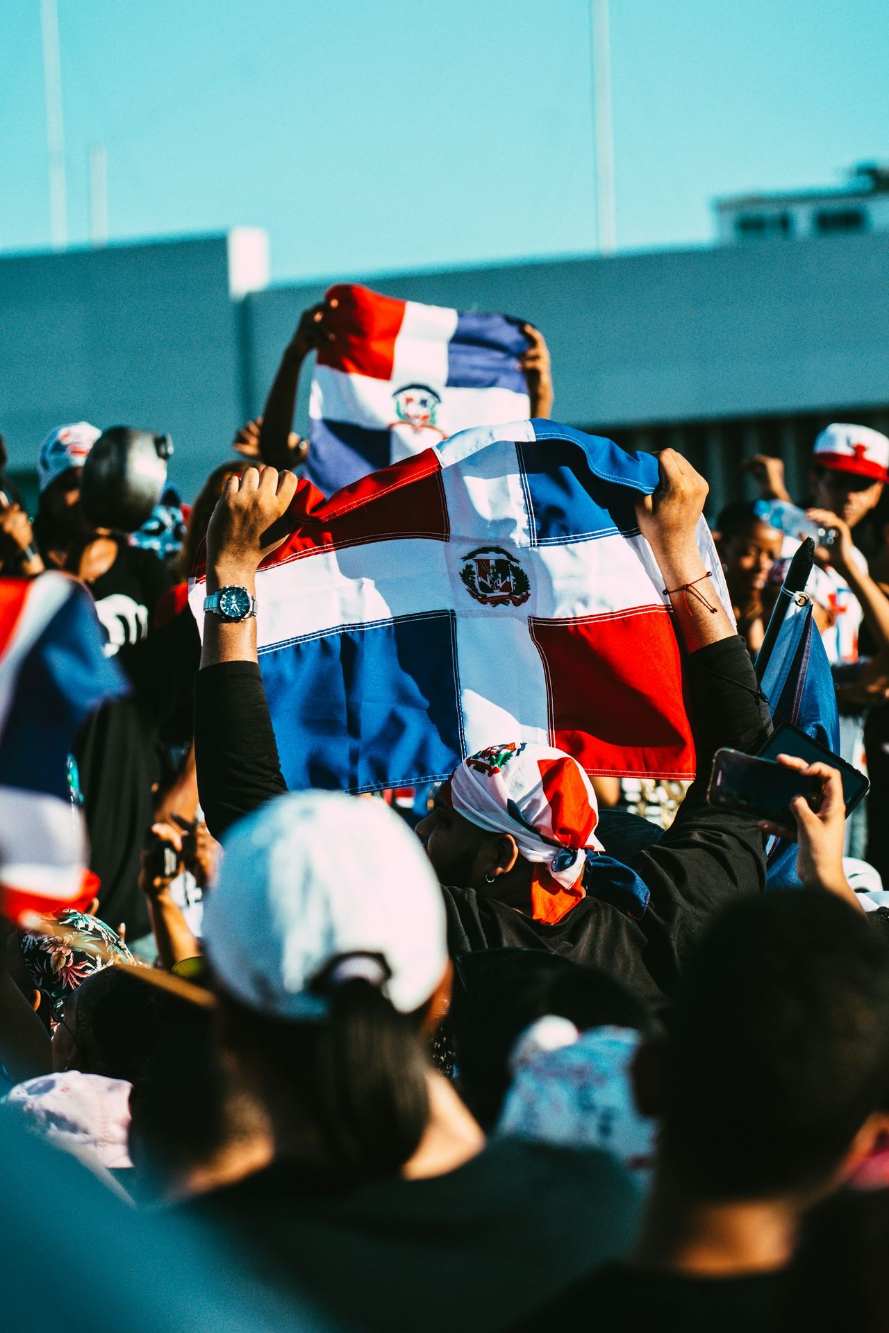 people in a stadium during daytime